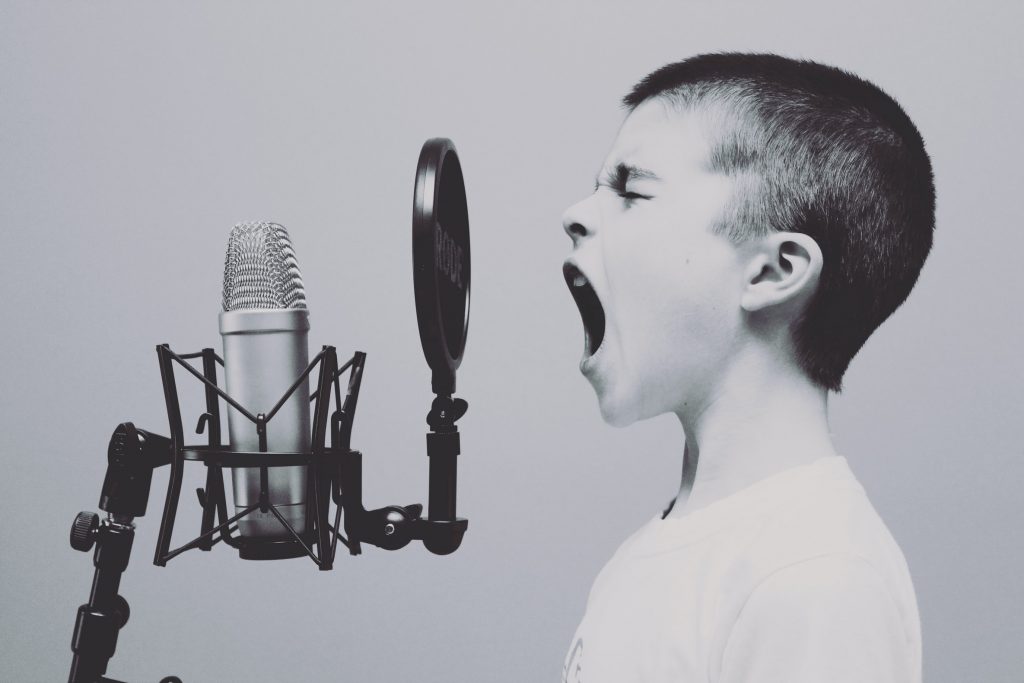 boy screaming into the microphone speech therapy